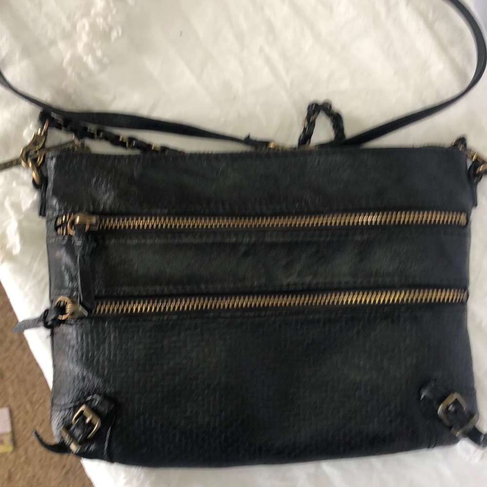 ELLIOT LUCCA black genuine leather crossbody. Adjustable straps. 3 way zippers.